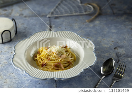 Italian Carbonara pasta dish with appetizing cheese and bacon 135101469