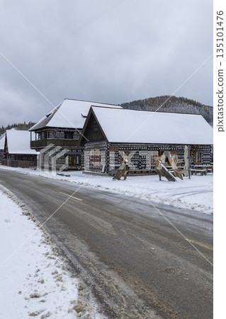 Cicmany village traditional painted wooden houses in winter 135101476