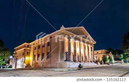 Galloway Memorial United Methodist Church is located in Jackson, Mississippi, USA. Historic Neoclassical architecture features the illuminated portico and massive stone columns under a dark night sky Galloway Memorial United Methodist Church is located in Jackson, Mississippi, USA. Historic Neoclassical architecture features the illuminated portico and massive stone columns under a dark night sky 135102117