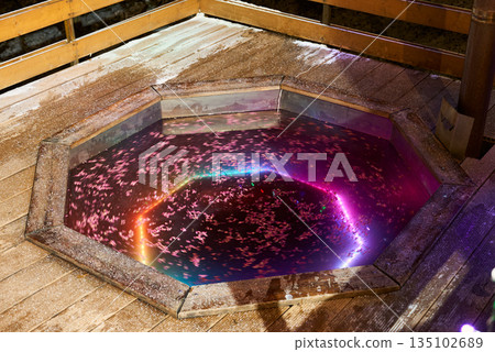 Serene spa surrounded by glowing petals and calming light Serene spa surrounded by glowing petals and calming light 135102689