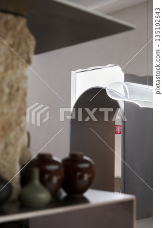 Stylist Scene With Pottery, Interior Styling Featuring Ceramic Vases And Soft Lighting Ambiance Stylist Scene With Pottery, Interior Styling Featuring Ceramic Vases And Soft Lighting Ambiance 135102843