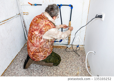 Homeowner wrapped section of incoming pipe with kraft foil over heating cable and secured it with plastic ties. Homeowner wrapped section of incoming pipe with kraft foil over heating cable and secured it with plastic ties. 135103252