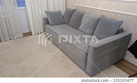 Contemporary sitting area showcasing serene aesthetics and cozy features Contemporary sitting area showcasing serene aesthetics and cozy features 135103477