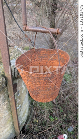 Rusty Bucket Closeup, Detailed Image Of Rusted Bucket Showing Deterioration And Surface Imperfections Rusty Bucket Closeup, Detailed Image Of Rusted Bucket Showing Deterioration And Surface Imperfections 135103478