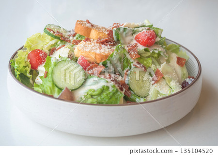 Caesar Salad: Crisp romaine lettuce tossed with Parmesan, croutons, and a creamy Caesar dressing, Caesar Salad: Crisp romaine lettuce tossed with Parmesan, croutons, and a creamy Caesar dressing, 135104520