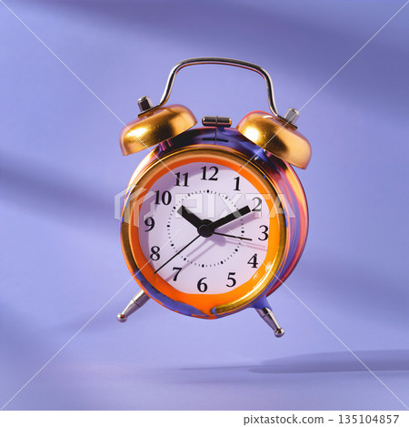 Colorful clock displays time on a simple surface under soft light during the daytime without distractions or clutter 135104857