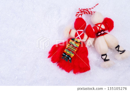 Spring background with white snow, snowdrops flowers and Bulgarian symbol of spring martenitsa. Spring background with white snow, snowdrops flowers and Bulgarian symbol of spring martenitsa. 135105276