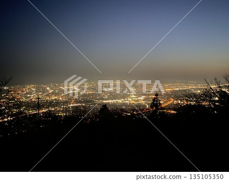 A quiet night town seen from a hill A quiet night town seen from a hill 135105350