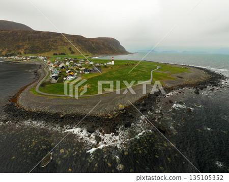 Panorama of Alesund, Norway, surrounded by the Norwegian Sea. Iconic coastal city with colorful buildings, fjords, and maritime landscape. Perfect for travel, architecture, and Nordic scenery concepts 135105352