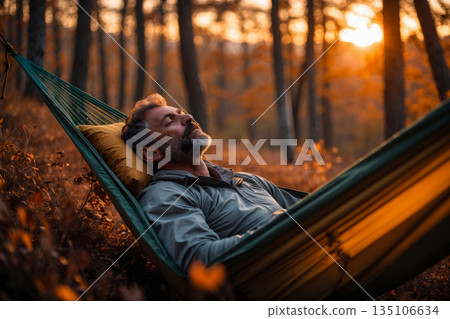Portrait man tourist in hammock on background autumn leaf fall in park forest nature AI Generative 135106634