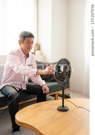 Senior man streaming video Senior man streaming video 135107056