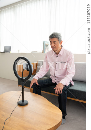 Senior man streaming video Senior man streaming video 135107059