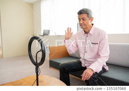 Senior man streaming video Senior man streaming video 135107060
