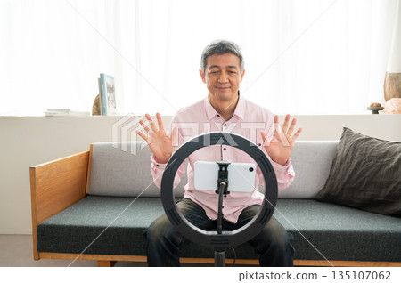 Senior man streaming video Senior man streaming video 135107062