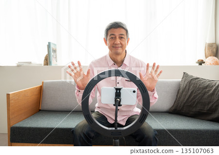 Senior man streaming video Senior man streaming video 135107063
