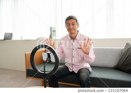 Senior man streaming video Senior man streaming video 135107064