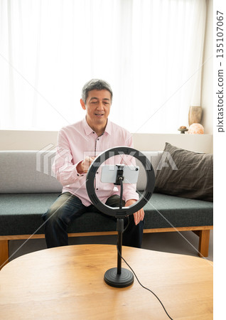Senior man streaming video Senior man streaming video 135107067