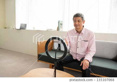 Senior man streaming video Senior man streaming video 135107068