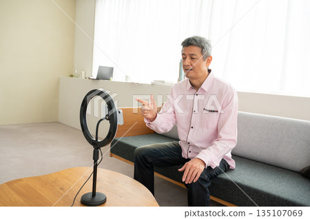 Senior man streaming video Senior man streaming video 135107069