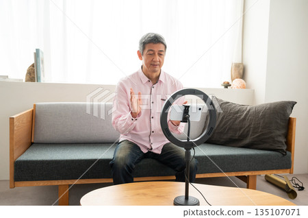 Senior man streaming video Senior man streaming video 135107071