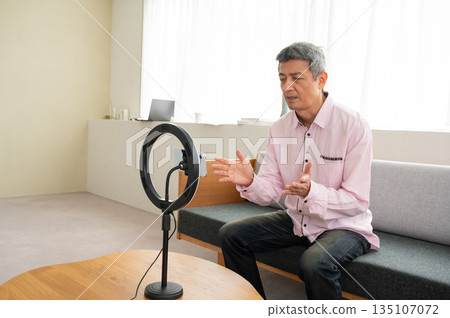 Senior man streaming video Senior man streaming video 135107072