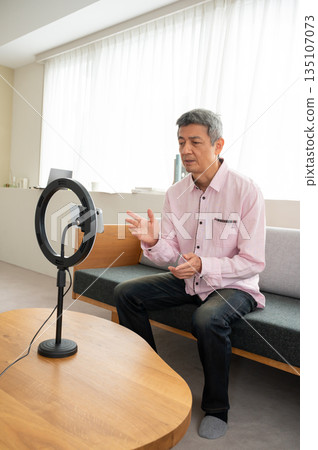 Senior man streaming video Senior man streaming video 135107073