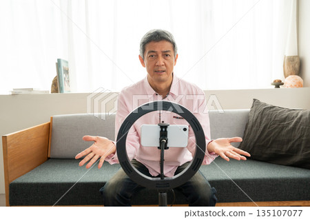 Senior man streaming video Senior man streaming video 135107077