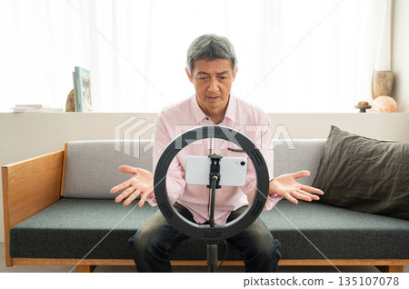 Senior man streaming video Senior man streaming video 135107078