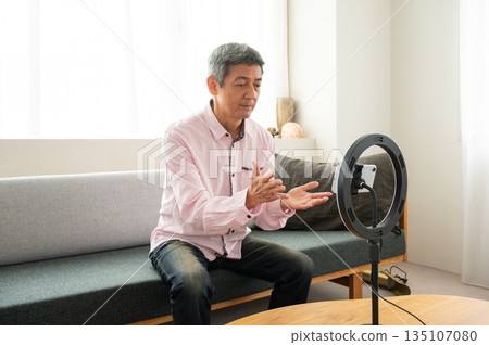 Senior man streaming video Senior man streaming video 135107080