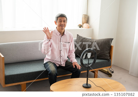 Senior man streaming video Senior man streaming video 135107082