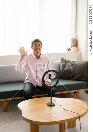 Senior man streaming video Senior man streaming video 135107083