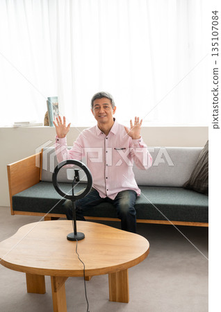 Senior man streaming video Senior man streaming video 135107084