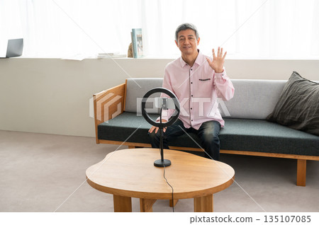 Senior man streaming video Senior man streaming video 135107085