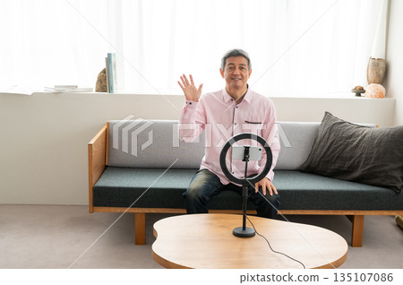 Senior man streaming video Senior man streaming video 135107086
