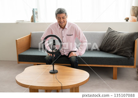 Senior man streaming video Senior man streaming video 135107088