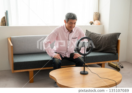 Senior man streaming video Senior man streaming video 135107089