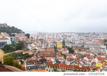 Colorful hillside view over historic Lisbon rooftops 135107234