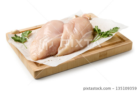 fresh chicken breast meat on cutting board fresh chicken breast meat on cutting board 135109359