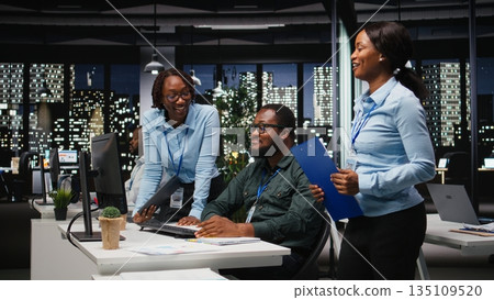 African american analysts collaborating on a project with financial forecasting, projecting data to expand the enterprise activity and profit. Teamwork in workspace to ensure objectives. 135109520