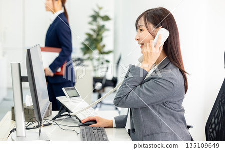 A woman making a phone call 135109649