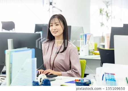 Business woman working in the office 135109650