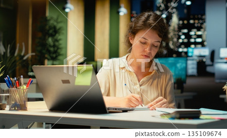 Corporate strategist ripping a paper after writing the wrong idea, restarting her work in rage and crumpling the page sheet, Discontent woman does a typo mistake while transcribing. Camera B. Corporate strategist ripping a paper after writing the wrong idea, restarting her work in rage and crumpling the page sheet, Discontent woman does a typo mistake while transcribing. Camera B. 135109674