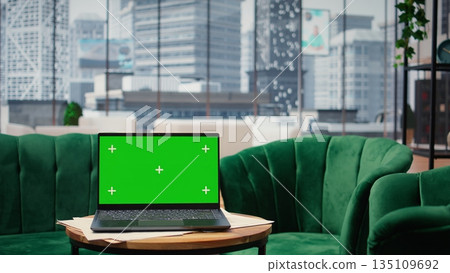 Empty modern luxurious office showcasing isolated display on laptop, high end workspace equipped with professional gadgets and networking system. Career development and motivation. 135109692