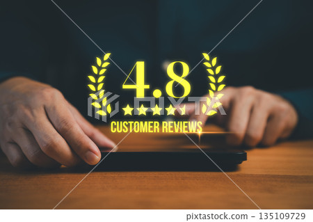 Customer hands using a smartphone with glowing 4.8 star rating and customer reviews. Concept of online feedback, business reputation, satisfaction score, quality service evaluation, and brand trust. 135109729