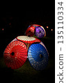Red Japanese umbrella illuminated 135110334