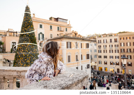 Woman enjoying festive city view near the Spanish Steps in Rome 135110664