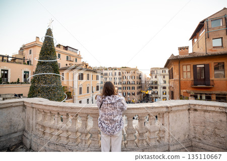 Woman enjoying festive city panorama near the Spanish Steps in Rome 135110667