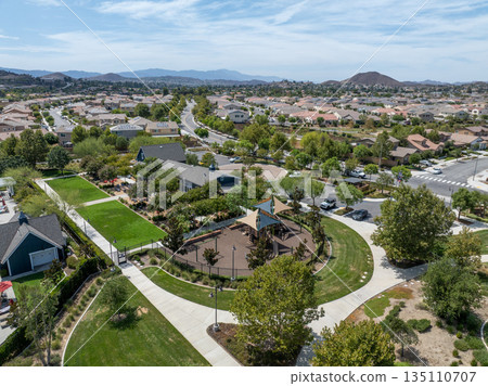 Aerial view of a sprawling neighborhood of family homes in Menifee, California, USA. Aerial view of a sprawling neighborhood of family homes in Menifee, California, USA. 135110707