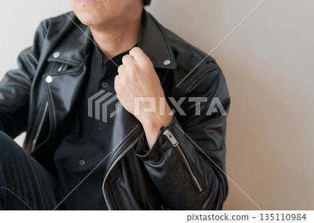 Body parts of a man in his 50s wearing a leather jacket Body parts of a man in his 50s wearing a leather jacket 135110984