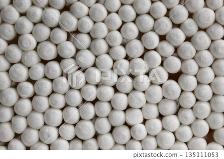 Macro Background of White Soft Cotton Swab Tips. High quality photo Macro Background of White Soft Cotton Swab Tips. High quality photo 135111053
